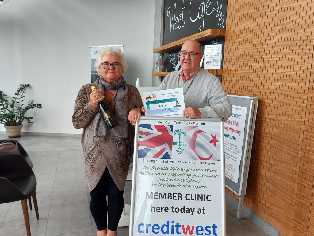 JUNE 2021 Monthly prize winner (person with the most correct guesses during the month) is: - Ann Lee seen here receiving her prize and certificate from the association chairman