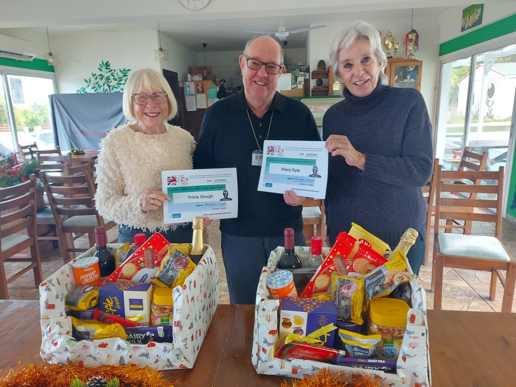 DECEMBER 2022 Overall Year End prize joint winners (persons with the most correct guesses during the year) are: - Tricia Gough (L) and Hilary Kyte (R) seen here receiving their prizes and certificates from the association chairman