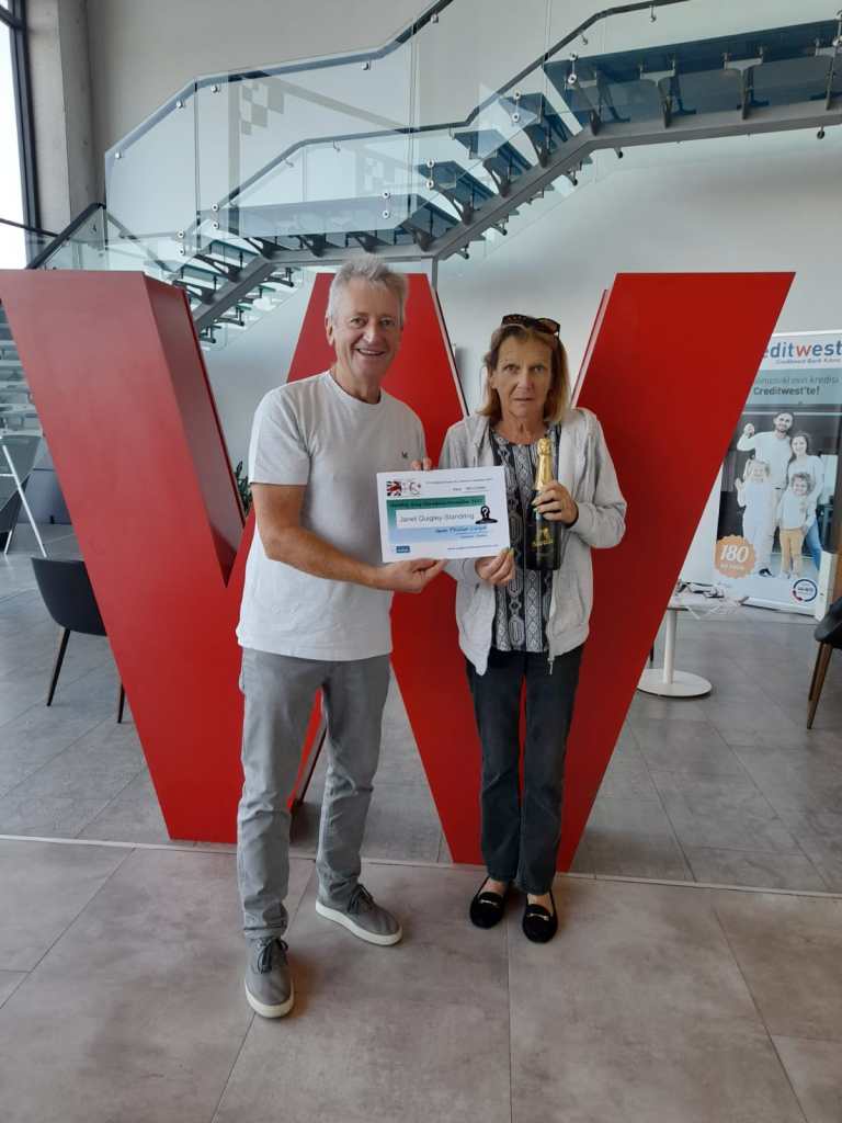 NOVEMBER 2022 Monthly prize winner (person with the most correct guesses during the month) is: - Janet Quigley-Standring seen here receiving her prize and certificate from the association treasurer Tim Morgan