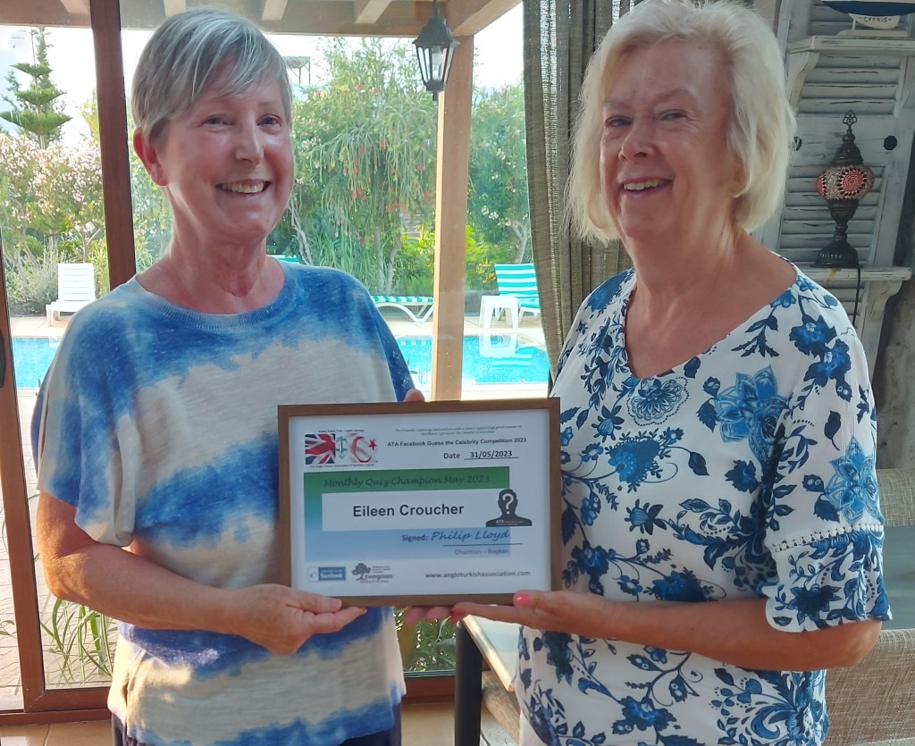 MAY 2023 Monthly prize winner (person with the most correct guesses during the month) is: –  Eileen Croucher (L) seen here receiving her winners certificate from the associations Sandra Whyte