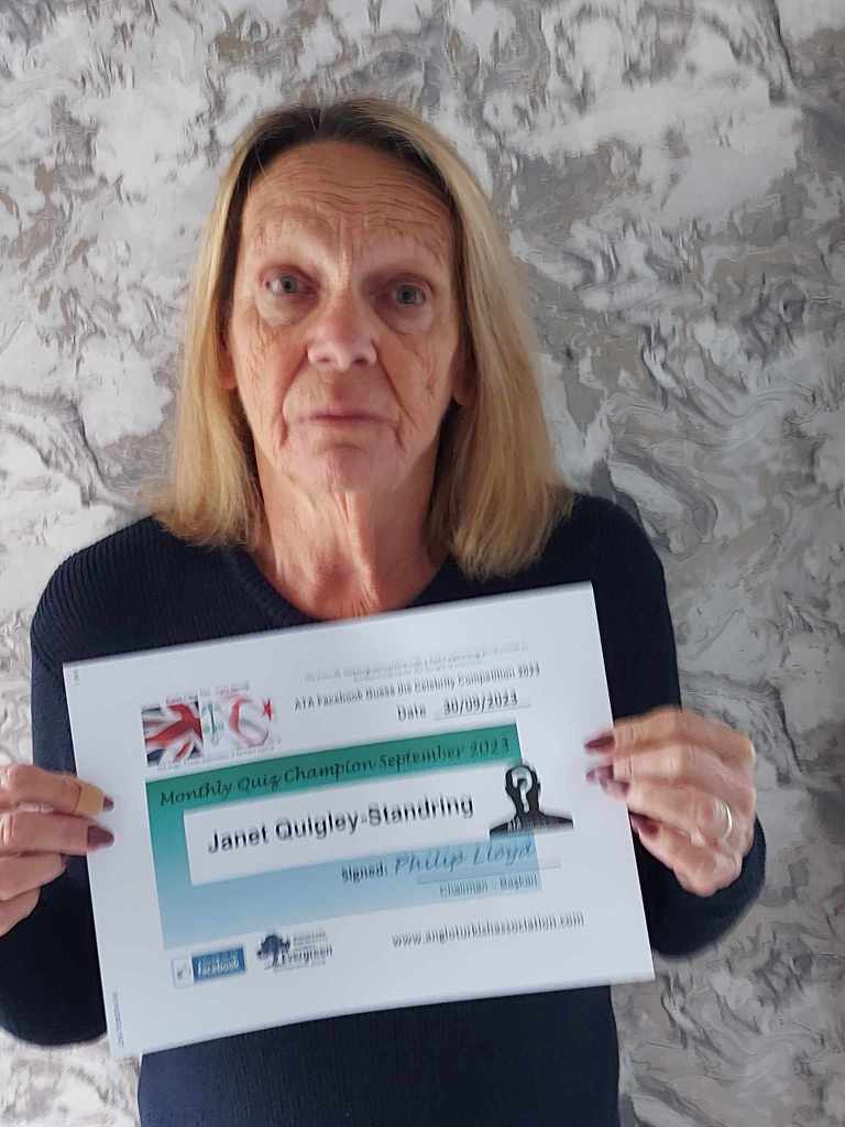 SEPTEMBER 2023 Monthly prize winner (person with the most correct guesses during the month) is: –  Janet Quigley-Standring seen here in the UK with a copy of her winners’ certificate (the framed original will be presented to Janet when she returns to Northern Cyprus).